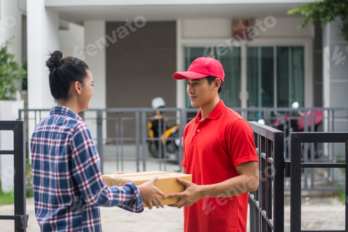 Preview: Young man Delivering Package to customer at home. Delivery