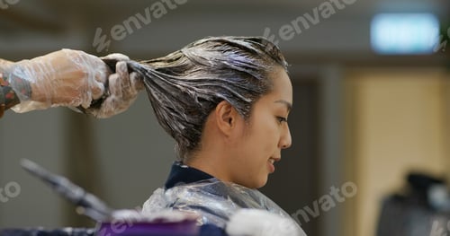 Preview: Woman Having Hair Dyed Indoors at Home