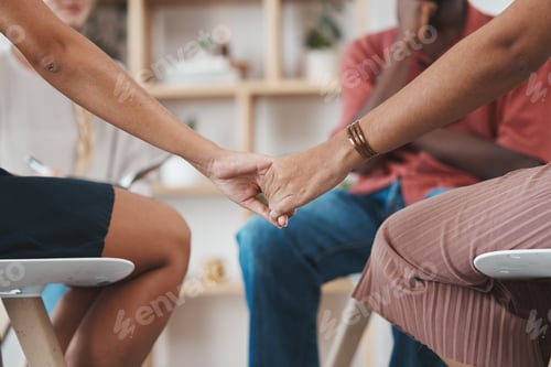 Preview: Support, trust and women holding hands at counseling session at addiction treatment clinic. Empathy