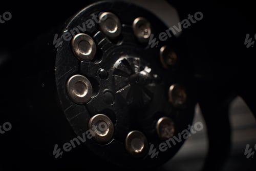 Preview: revolver cylinder with Flobert ammo 4mm on dark wooden background