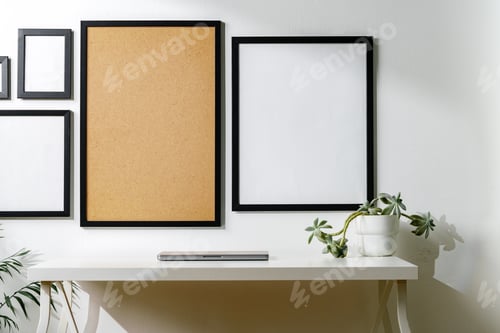 Preview: Set of black frames on white wall with copy space