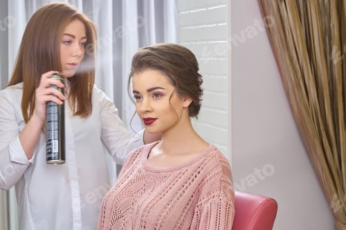 Woman Getting Hair Styled by Hair Stylist