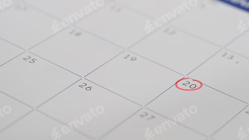 Preview: Close up of a calendar page with the 20th day circled in red, representing an important appointment