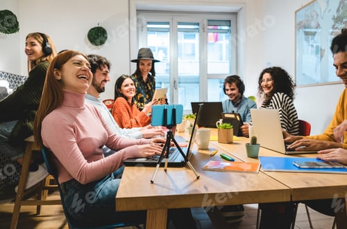 Preview: Young business people working inside coworking office - Focus on right girl hands