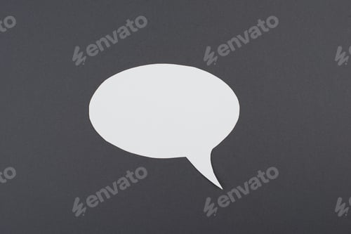 Preview: Empty speech bubble, white paper on a dark grey background, copy space for text