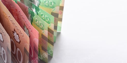 Preview: Canadian dollar bills standing up vertically