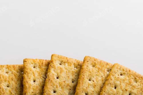 Preview: Overhead view of crackers arranged on white background with copy space