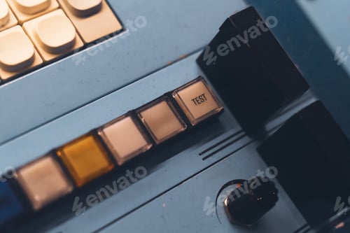 Preview: Closeup of vintage control panel with test button