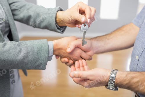 Preview: Close Up Of A Man Receiving A Handshake And A Key At The Same Time