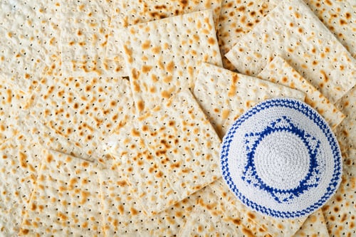 Preview: Passover celebration concept. Matzah, red kosher, white and yellow roses and walnut. Traditional rit