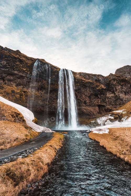 Preview: Seljalandsfoss waterfall flowing in autumn wilderness at Iceland