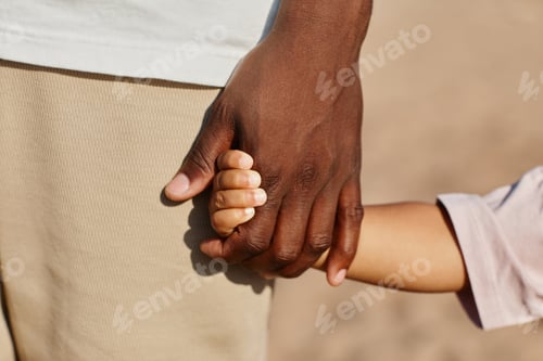 Preview: African American Father and Son Holding Hands