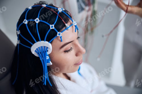 Preview: Calm patient undergoing the EEG procedure performed by a neurophysiologist