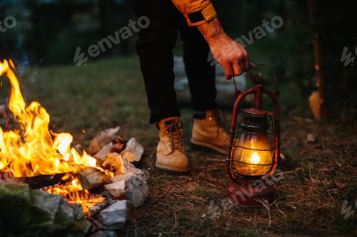 Preview: The traveler uses a kerosene lamp. Setting up a shelter in the forest for the night.