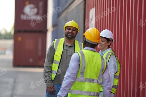 Preview: Foreman control loading Containers box from Cargo freight ship for import export.