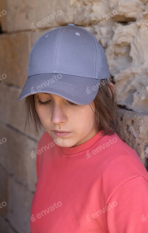 Preview: Teenager girl in grey baseball cap and long sleeve shirt outdoor, mockup