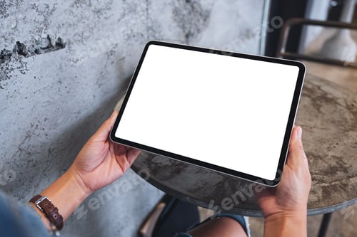 Preview: Mockup image of a woman holding digital tablet with blank white desktop screen
