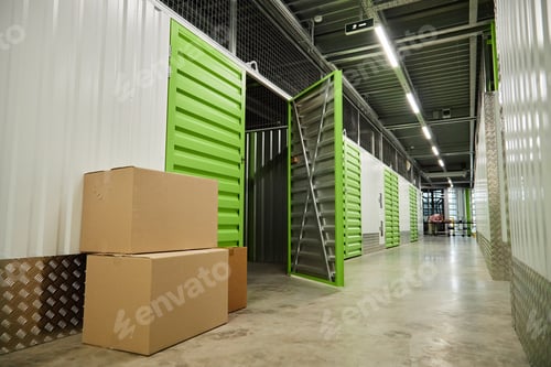 Preview: Cardboard Boxes Standing in Modern Self Storage Facility Corridor