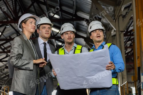 Preview: Chief engineer consults and analyzes train diesel engine problems Railway tracks in a train depot