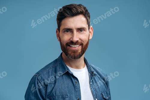 Preview: Portrait of cheerful handsome man in denim shirt smiling to the camera