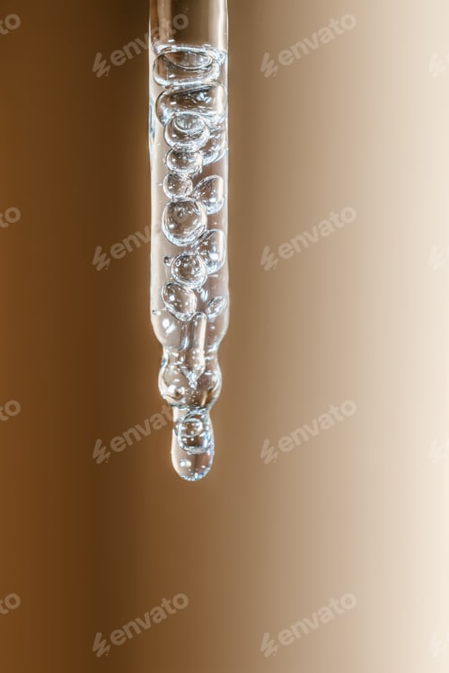 Preview: A drop of cosmetic oil falls from the pipette