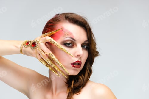 Preview: Close-Up Portrait On A White Background Of A Pretty Young Brunette Woman With Beautiful Makeup