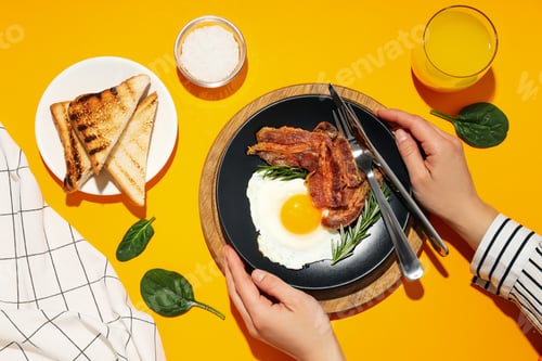 Preview: Fried bacon and egg - tasty breakfast, top view