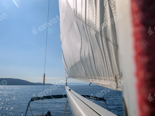 Preview: View of the sea with boats from the bow of a sailboat