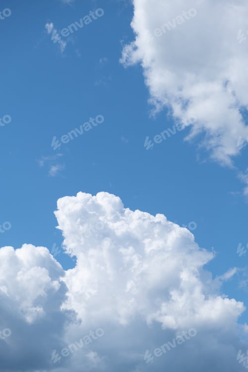 Preview: Big white clouds in a blue sky close-up. There is a place for the text