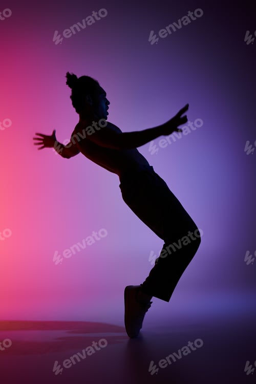 Preview: A silhouette of grace: young dancer in motion