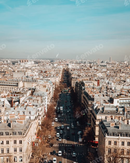 Preview: High angle view of The Avenue des Champs-Elysees under sunlight and a blue sky in Paris