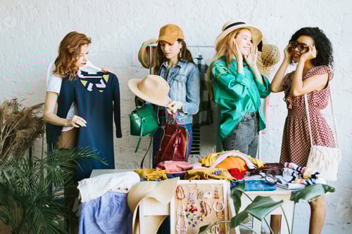 Preview: Women shopping and looking at clothing at boutique