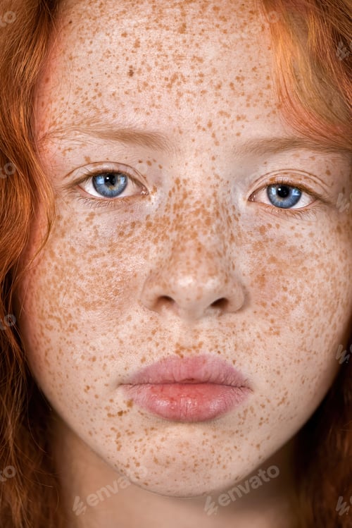 Preview: Portrait of a red-haired girl with freckles