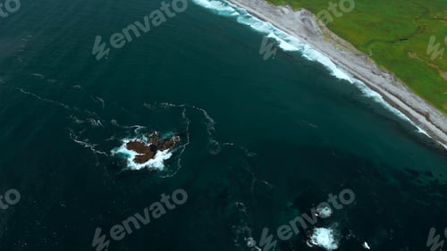 Preview: Aerial view of the emerald green field and blue sea of Japan. Clip. Summer seascape with blue cloudy