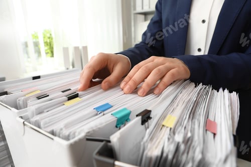 Preview: Woman taking documents from folder in archive, closeup
