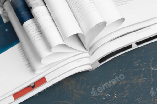 Preview: Close up stacking magazine place on table background