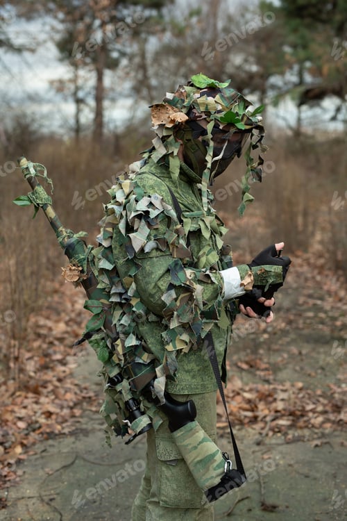 Preview: Sniper soldier reloads his sniper rifle for airsoft.