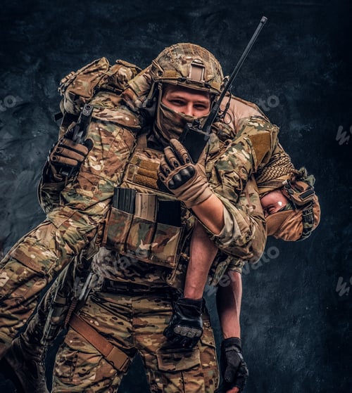 Preview: Rescuer Carrying Comrade in Camouflage Gear