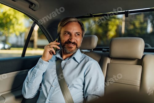 Preview: Man Talking on Phone in Car