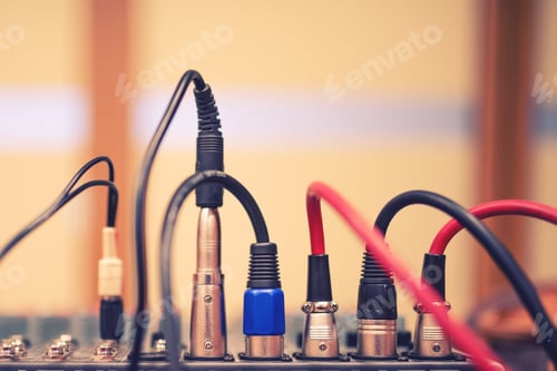 Preview: audio jack and wires connected to audio mixer, music dj equipment at concert, festival or party