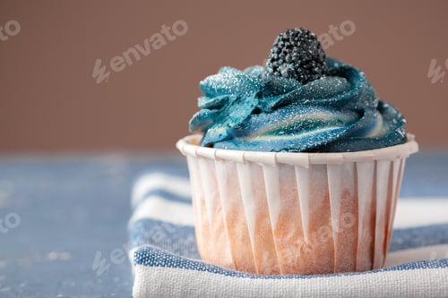 Preview: Group of cupcakes on dark background selective focus
