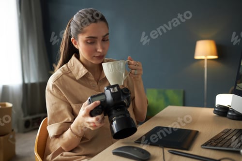 Preview: Drinking Coffee While Holding Camera in Home Office