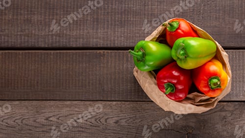 Preview: Big paper bag with paprika on wooden background
