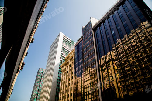 Preview: Low angle shot of a beautiful modern building with covered with windows in downtown Rio Brazil