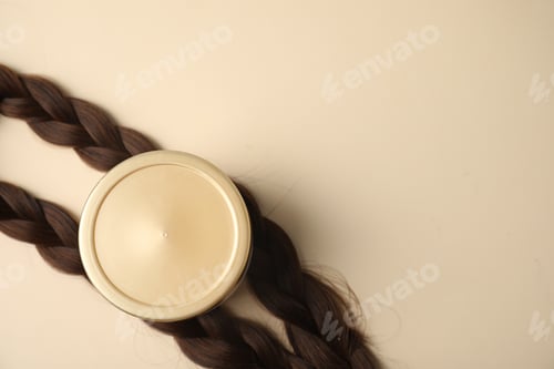 Preview: Braided hair locks and cosmetic product on beige background, flat lay. Space for text