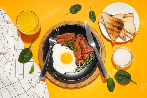 Preview: Fried bacon and egg - tasty breakfast, top view