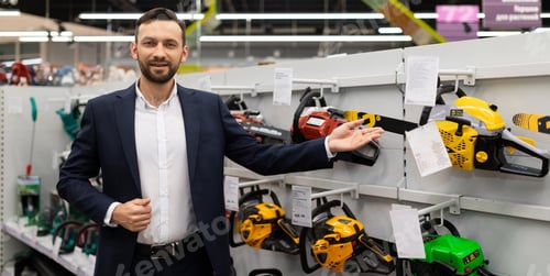Preview: portrait of a shop manager selling petrol saws