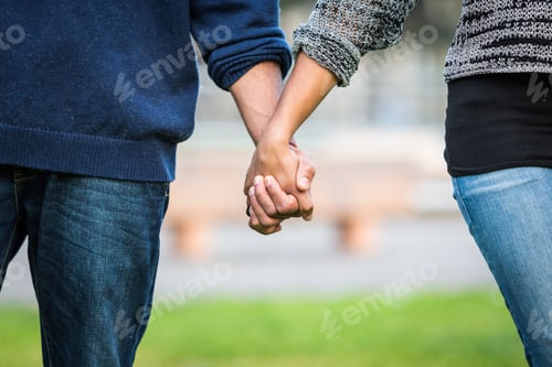 Preview: Mixed-Race Couple Holding Hands