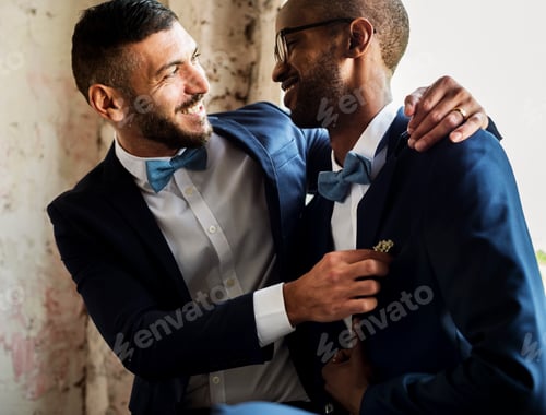 Preview: Gay Couple in Navy Blue Tuxedo Sitting Together