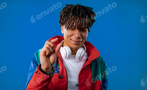Preview: Young african american man showing invisible abstract small subject or object.